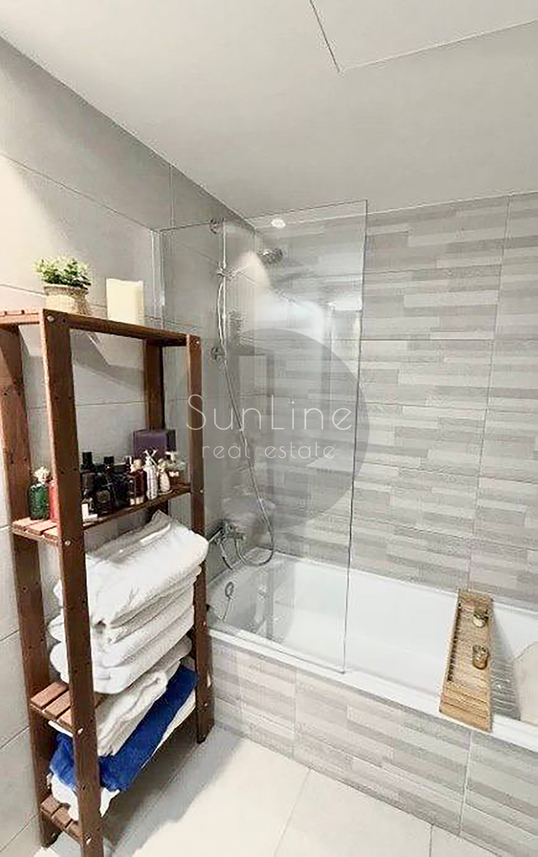 Renting a stylish apartment with a terrace, pool, and garage in Malilla