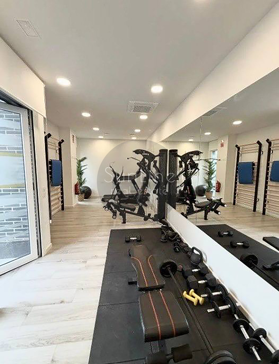 Renting a stylish apartment with a terrace, pool, and garage in Malilla