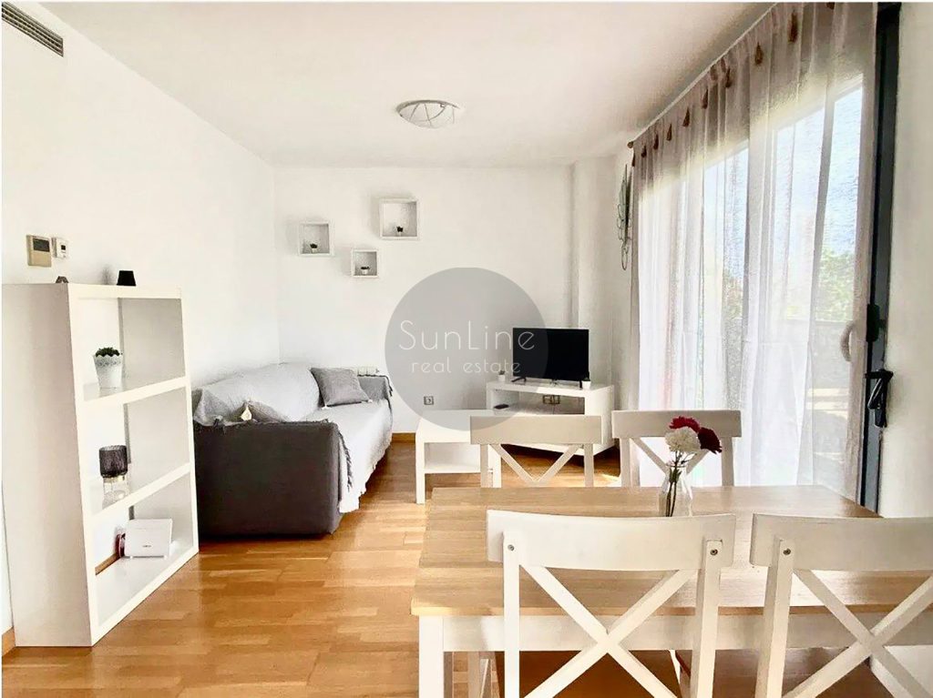 Rent of a contemporary apartment with a pool, garden, and garage in Campanare