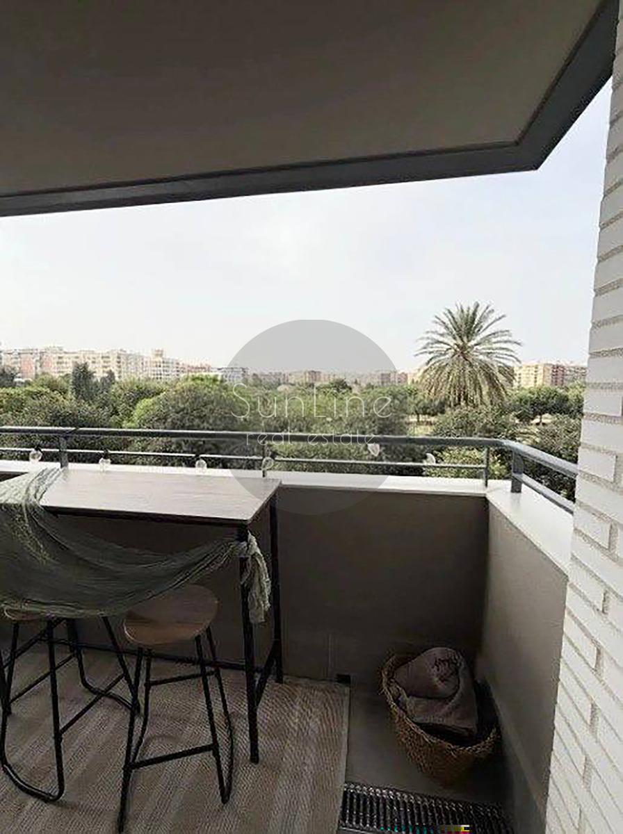 Renting a stylish apartment with a terrace, pool, and garage in Malilla