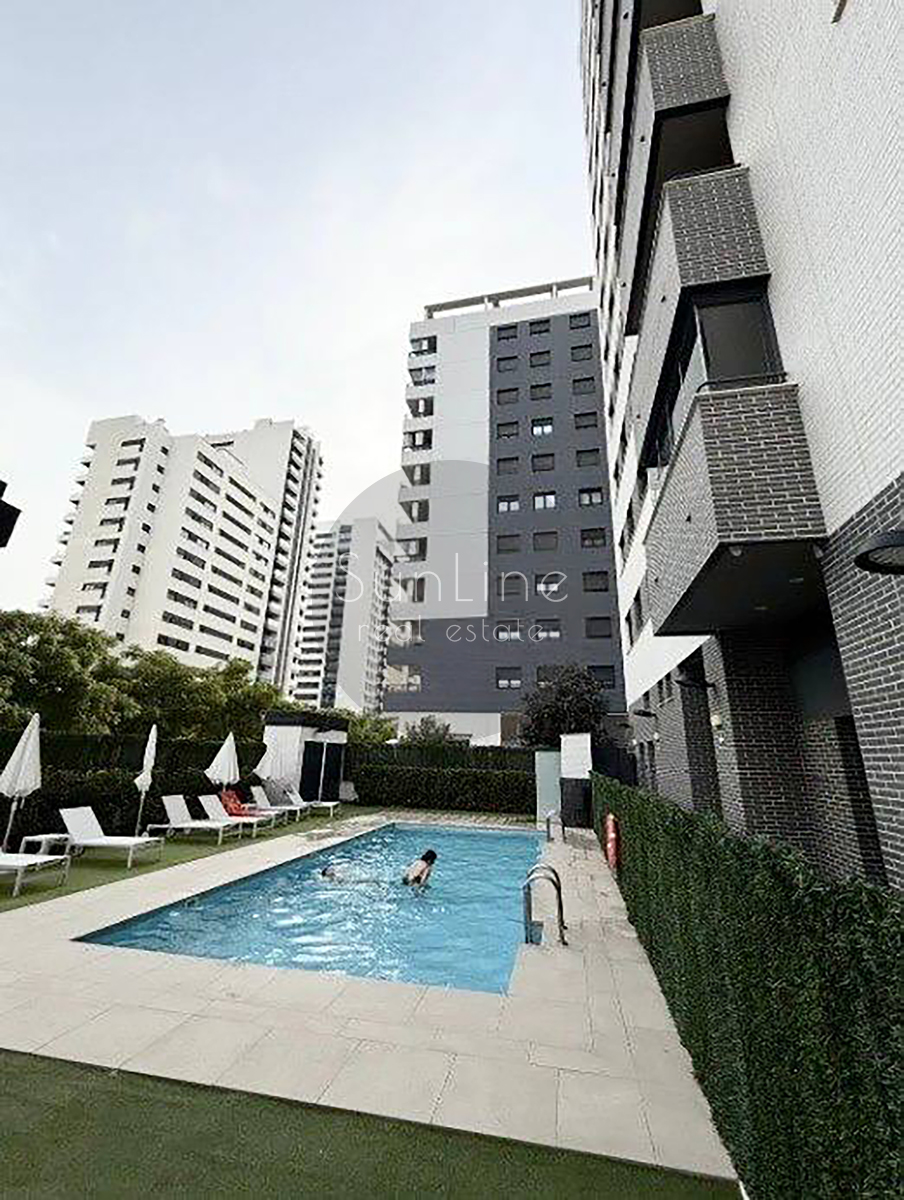 Renting a stylish apartment with a terrace, pool, and garage in Malilla
