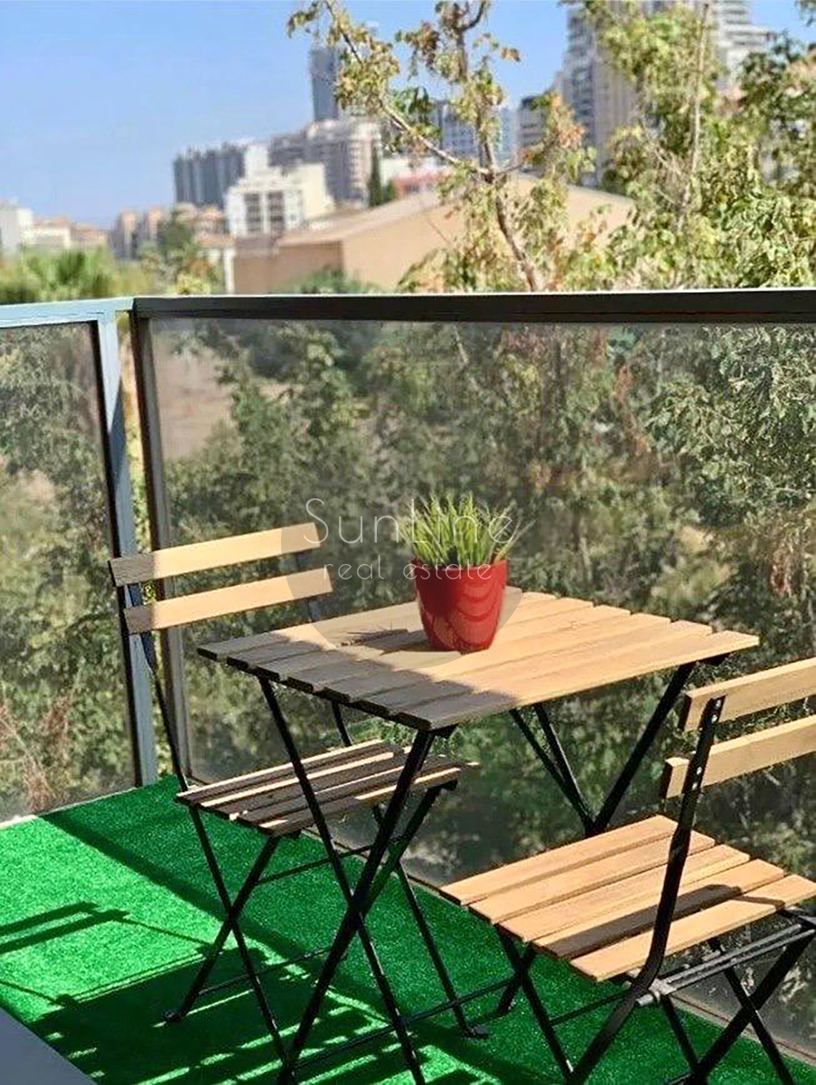 Rent of a contemporary apartment with a pool, garden, and garage in Campanare