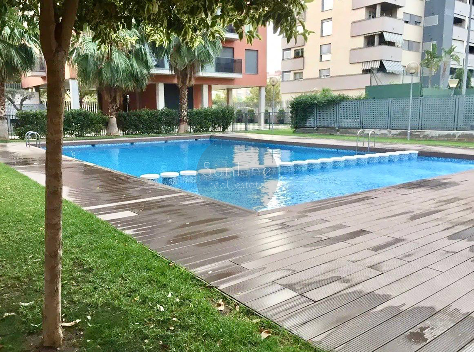 Rent of a contemporary apartment with a pool, garden, and garage in Campanare