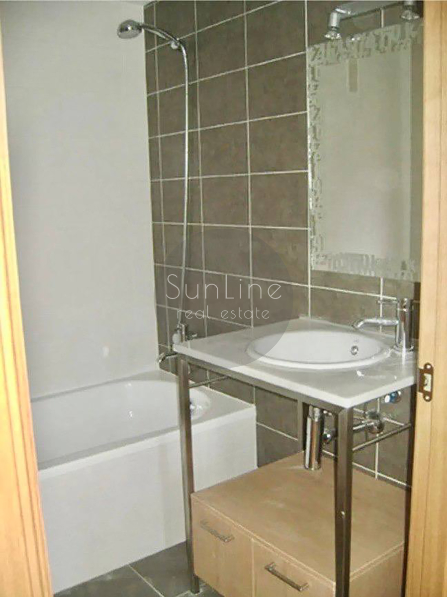 Rent of a contemporary apartment with a pool, garden, and garage in Campanare