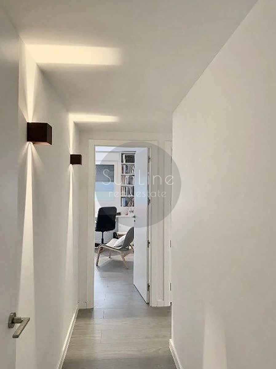 Renting a stylish apartment with a terrace, pool, and garage in Malilla