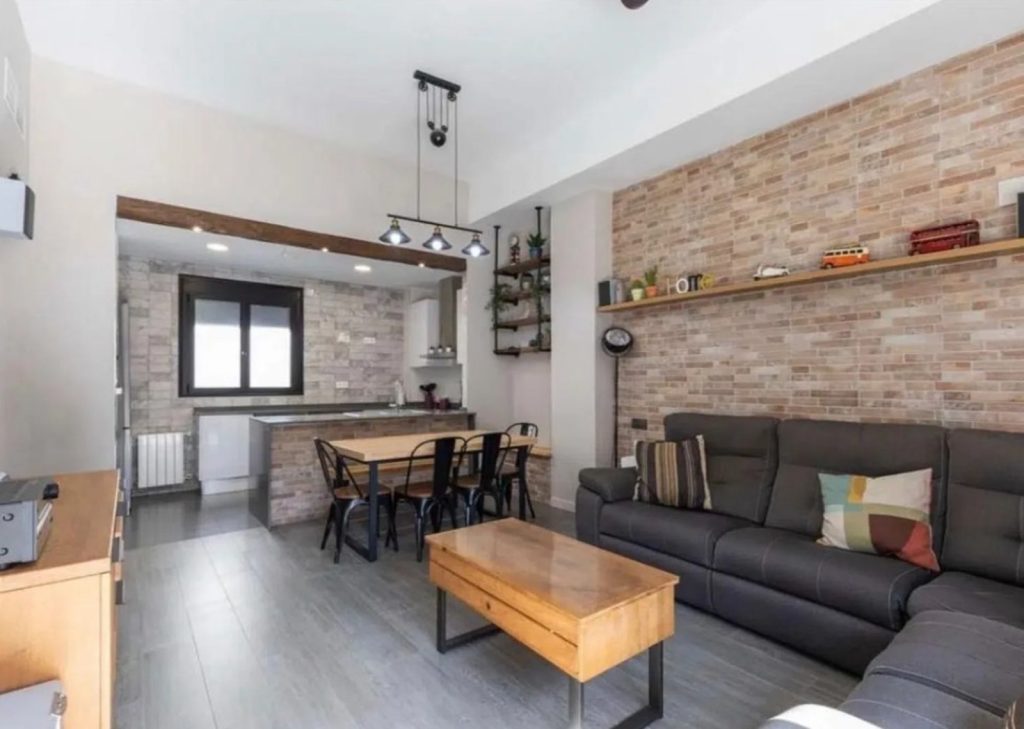Modern townhouse with a pool, garage, and spacious terraces in Benicalap
